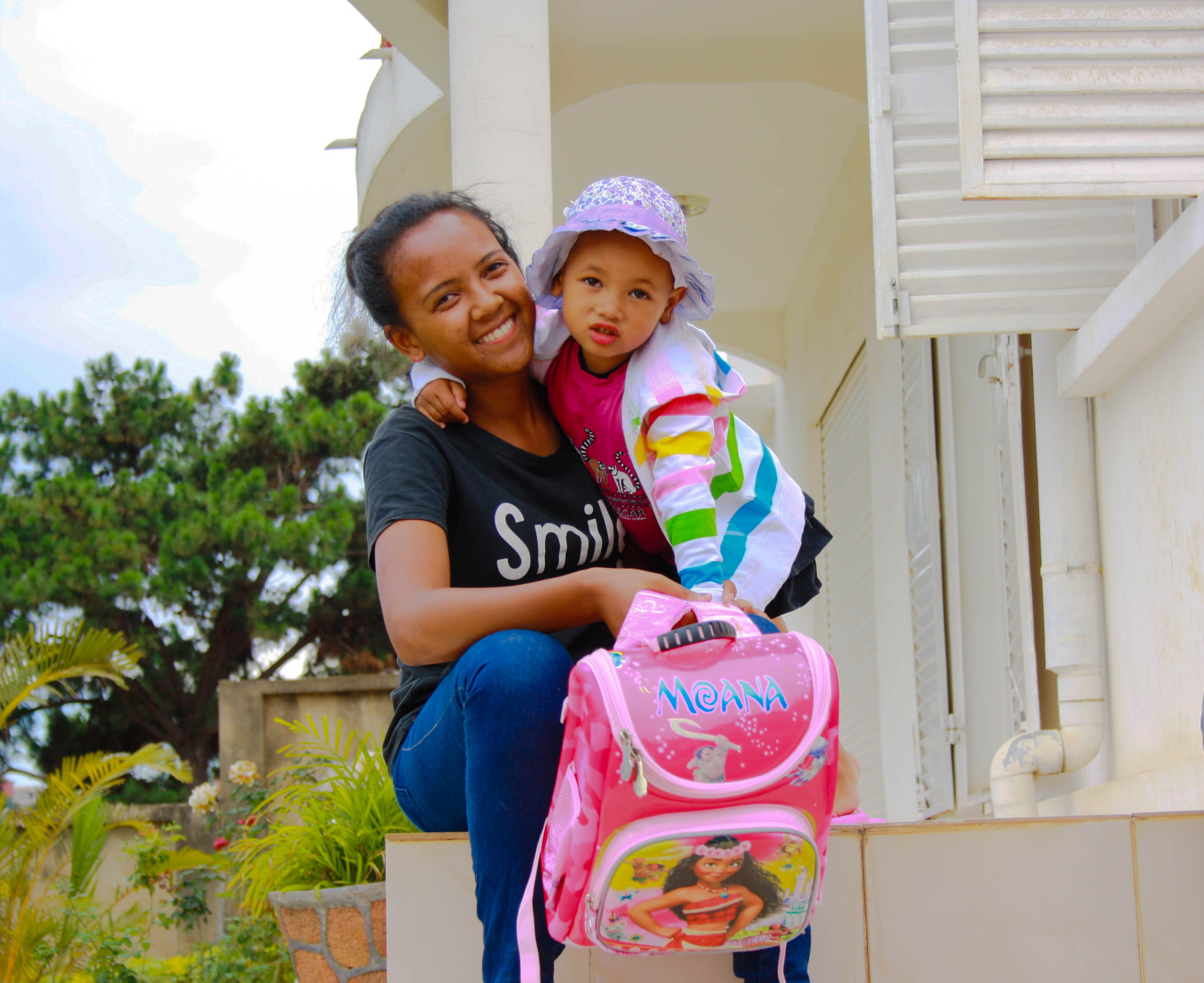 Au pair holding a child